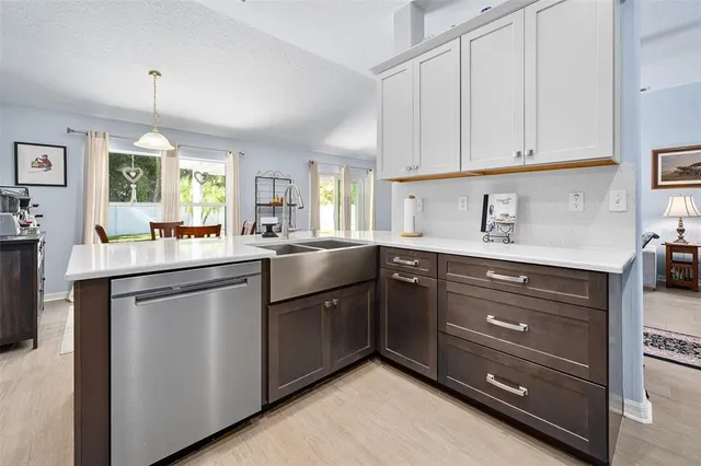 a bathroom with a sink a mirror and a shower