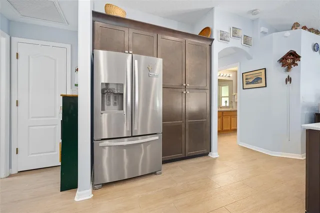 a bathroom with a granite countertop sink a toilet and a mirror