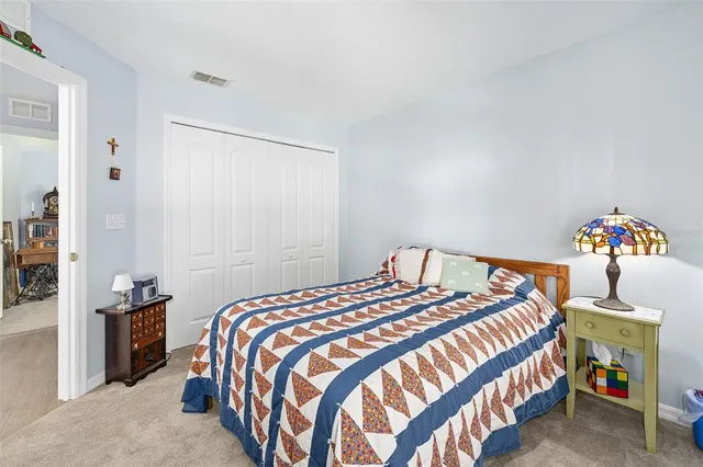 a bed sitting in a room next to a window