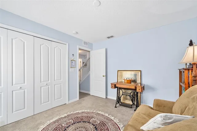 a bath tub sitting in a bathroom next to a window