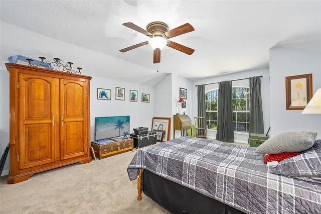 a view of a patio with table and chairs and potted plants