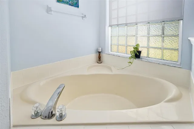 a picture of a bathroom with a shower