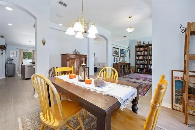 a swimming pool with outdoor seating and yard