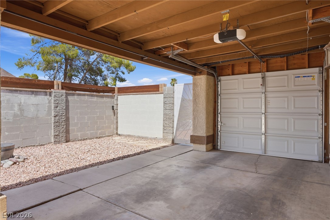 3971 Spring Leaf Drive Las Vegas, NV 89147 - Photo 26 of 48 Secure parking solutions with a robust garage door and an adjacent private yard.