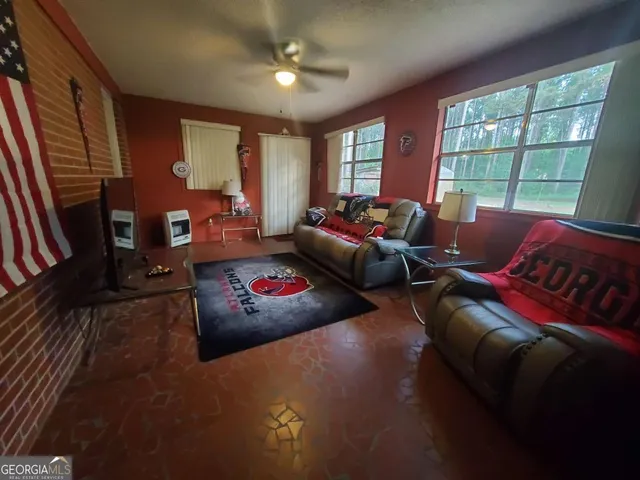 a living room with furniture and a window