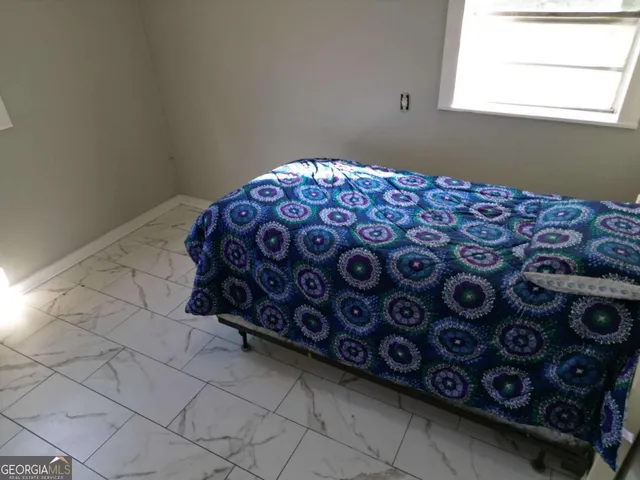 a bedroom with a bed