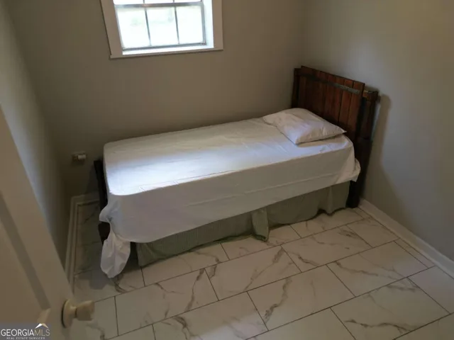 a bedroom with a bed