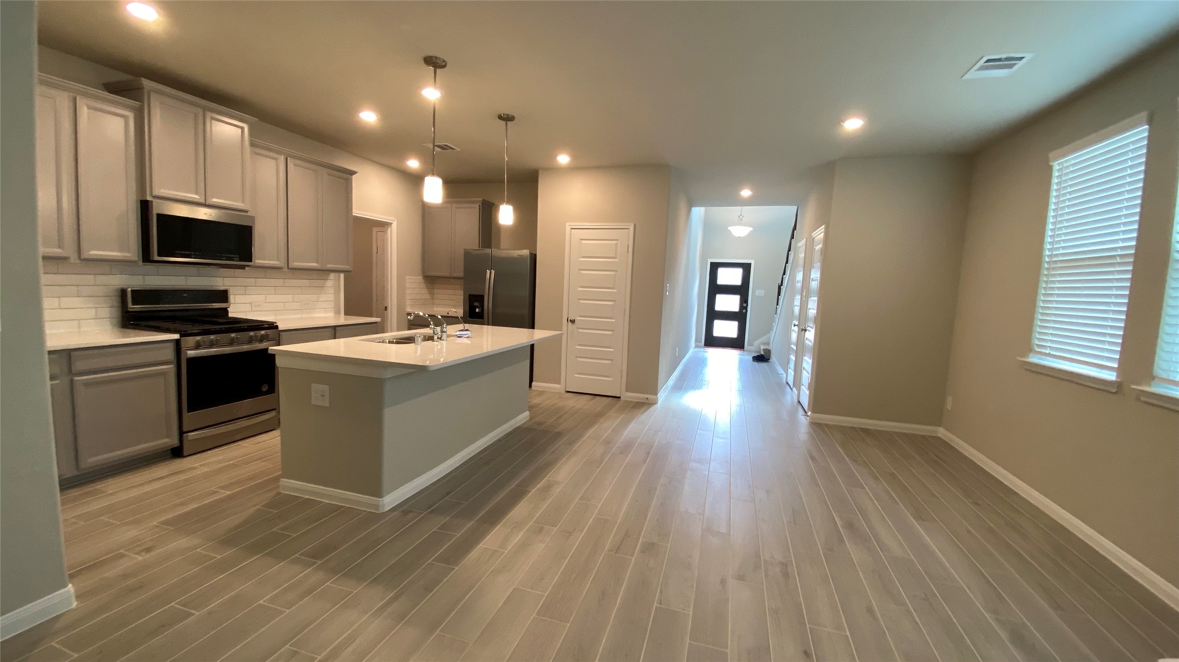7059 Silverleaf Oak Street Conroe, TX 77304 - Photo 11 of 29 a kitchen with a sink and steel appliances