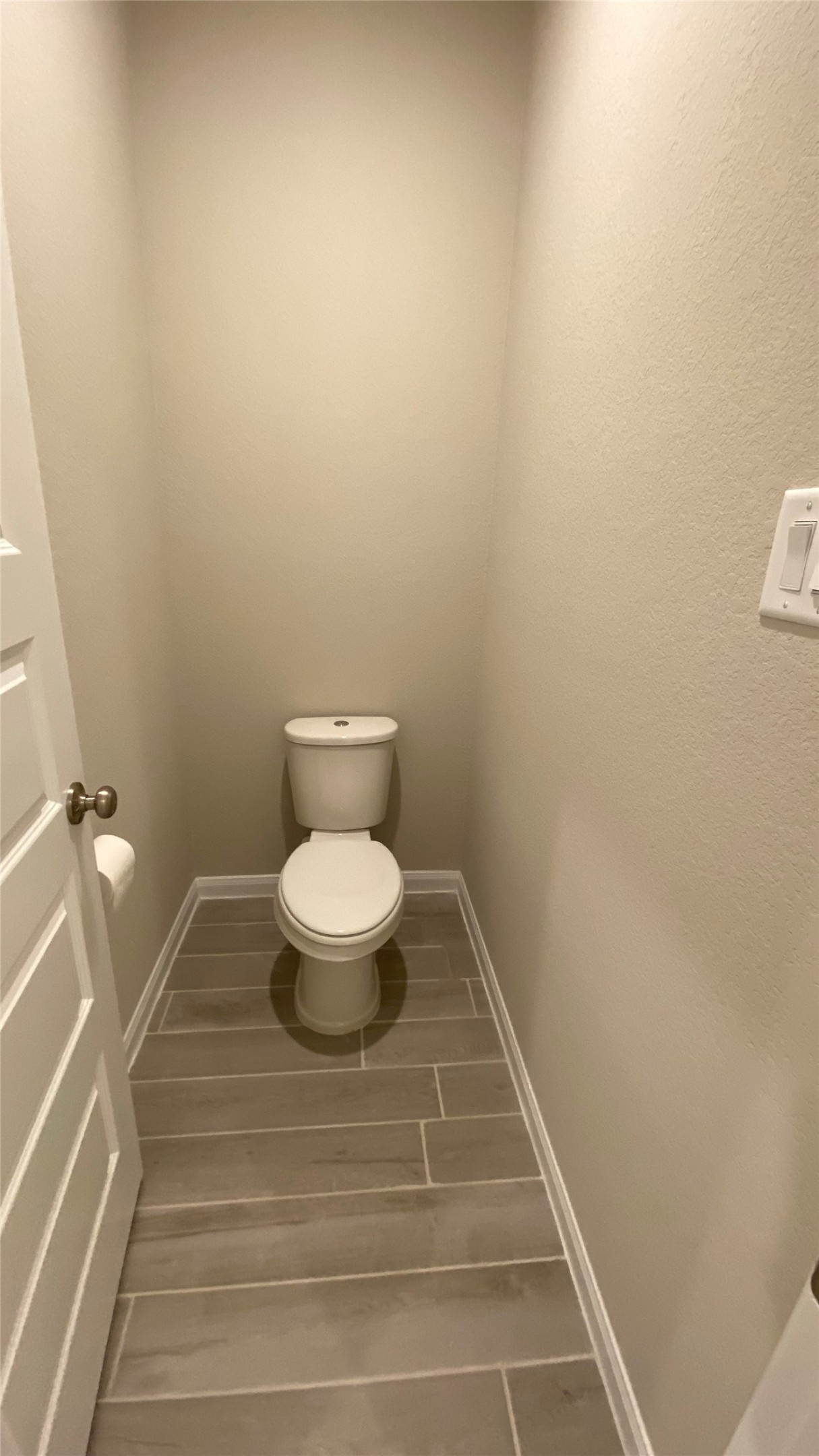 7059 Silverleaf Oak Street Conroe, TX 77304 - Photo 14 of 29 a bathroom with a toilet and a sink