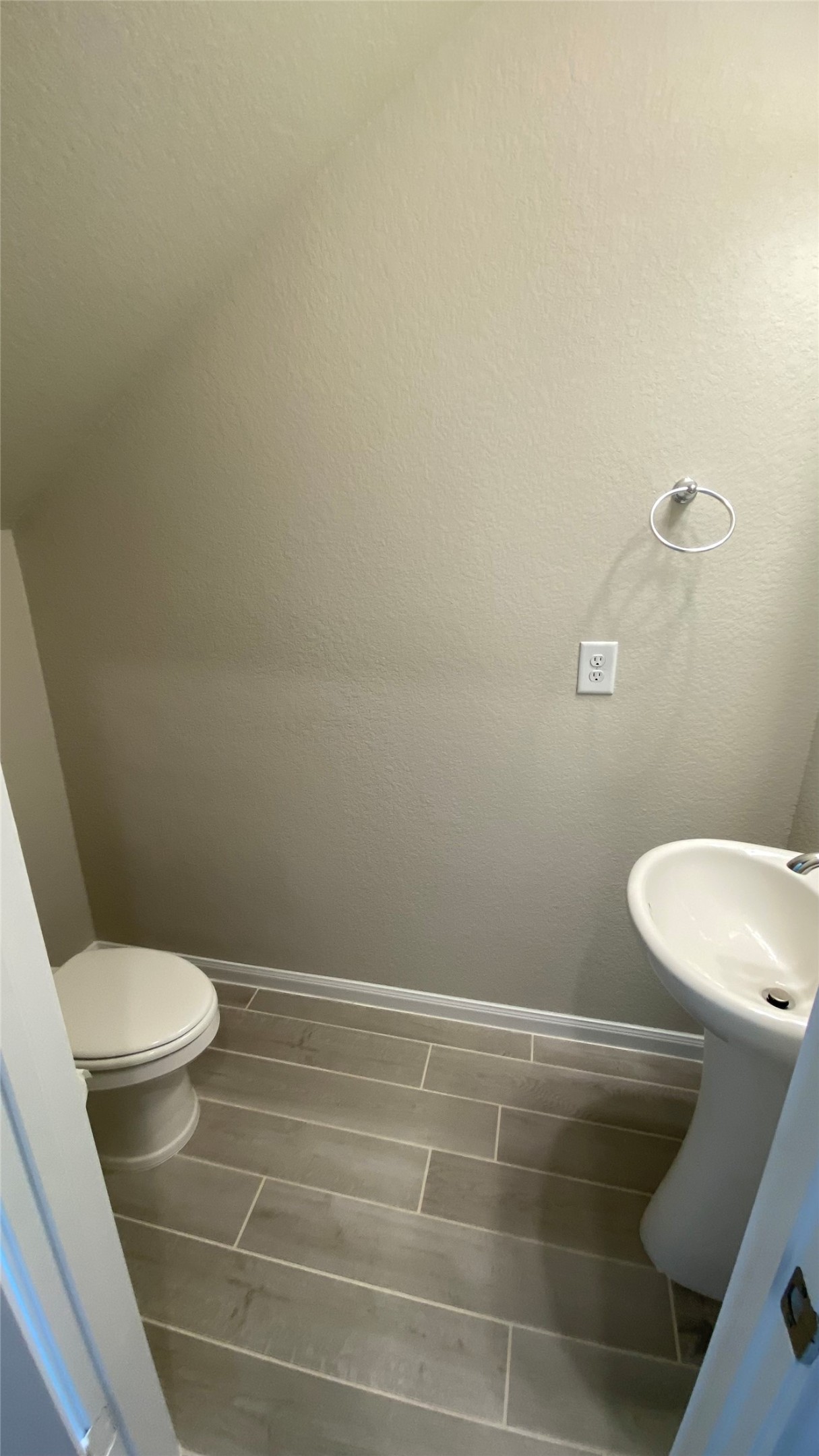 7059 Silverleaf Oak Street Conroe, TX 77304 - Photo 18 of 29 a white toilet sitting next to a shower