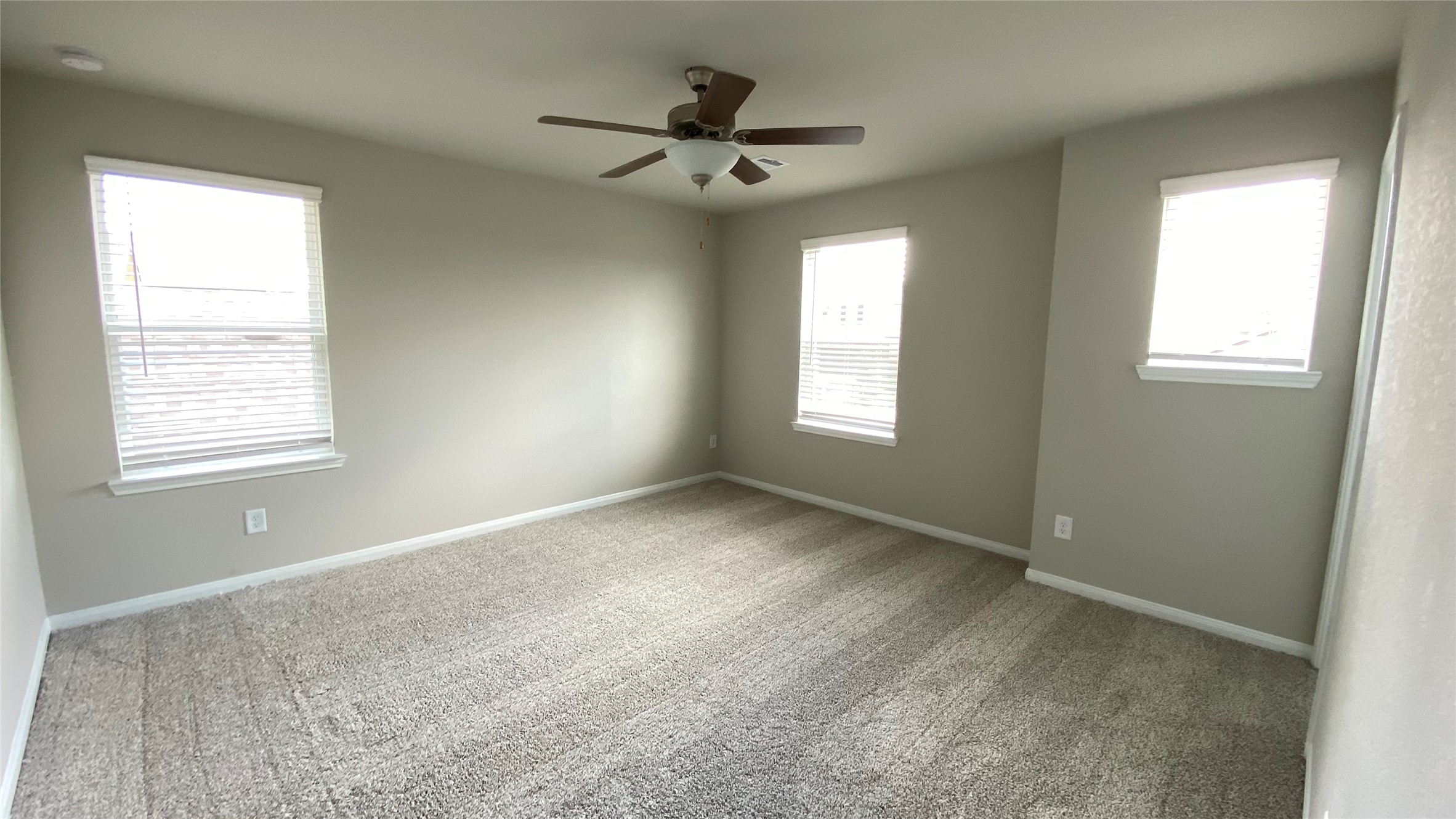 7059 Silverleaf Oak Street Conroe, TX 77304 - Photo 20 of 29 a view of a livingroom with a ceiling fan and window