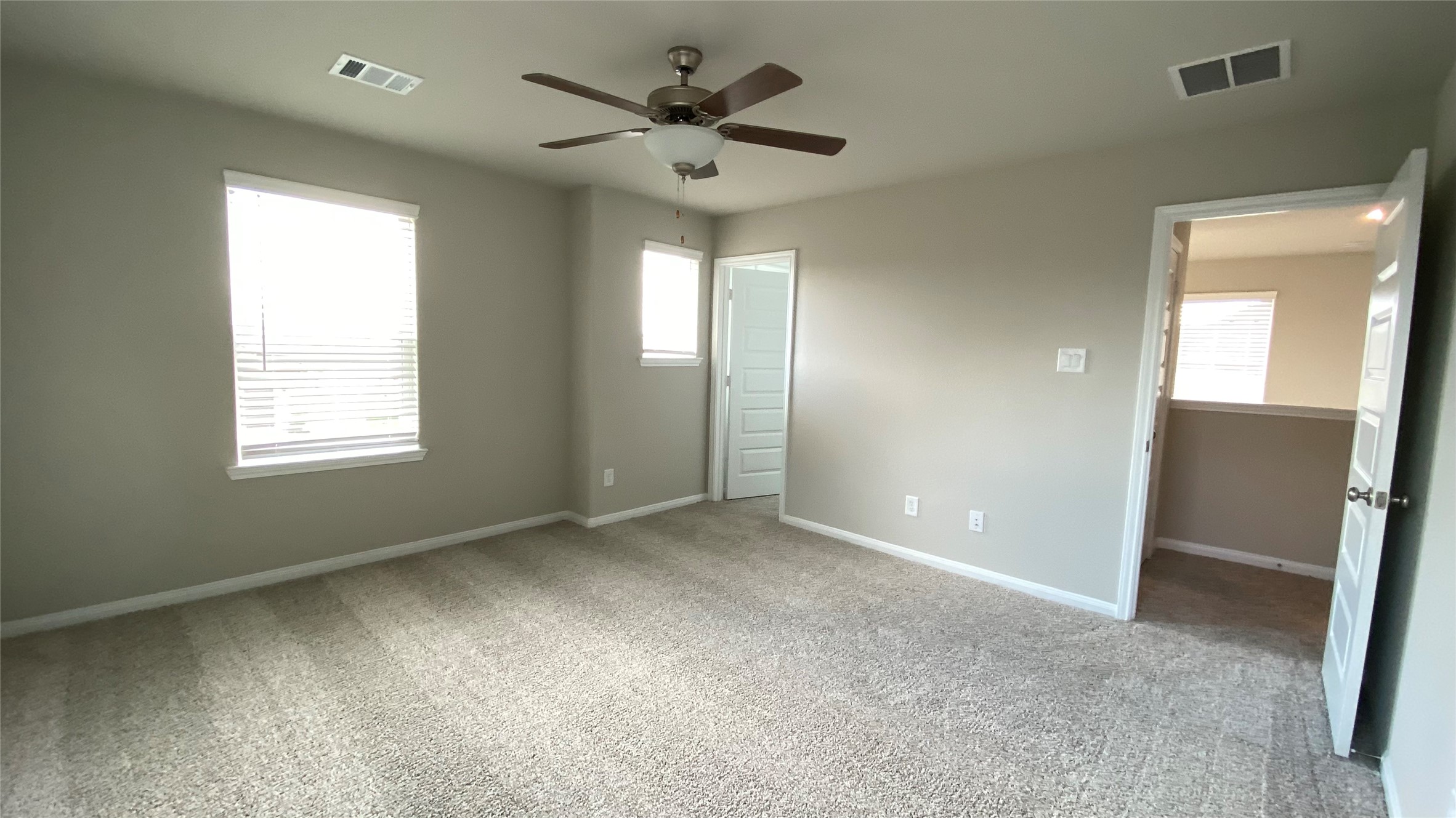 7059 Silverleaf Oak Street Conroe, TX 77304 - Photo 21 of 29 a view of an empty room with a window