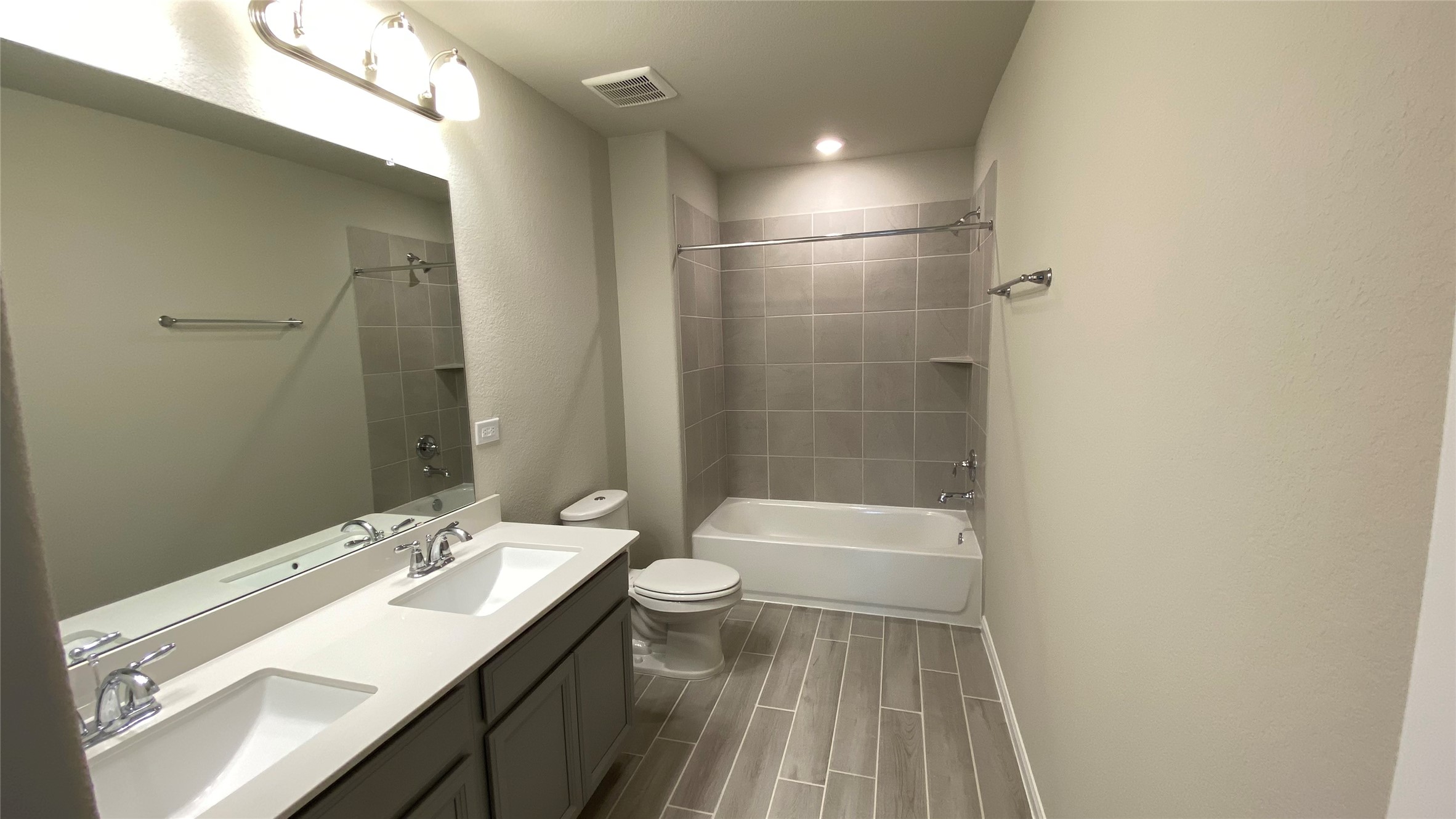 7059 Silverleaf Oak Street Conroe, TX 77304 - Photo 22 of 29 a bathroom with a sink a toilet and shower