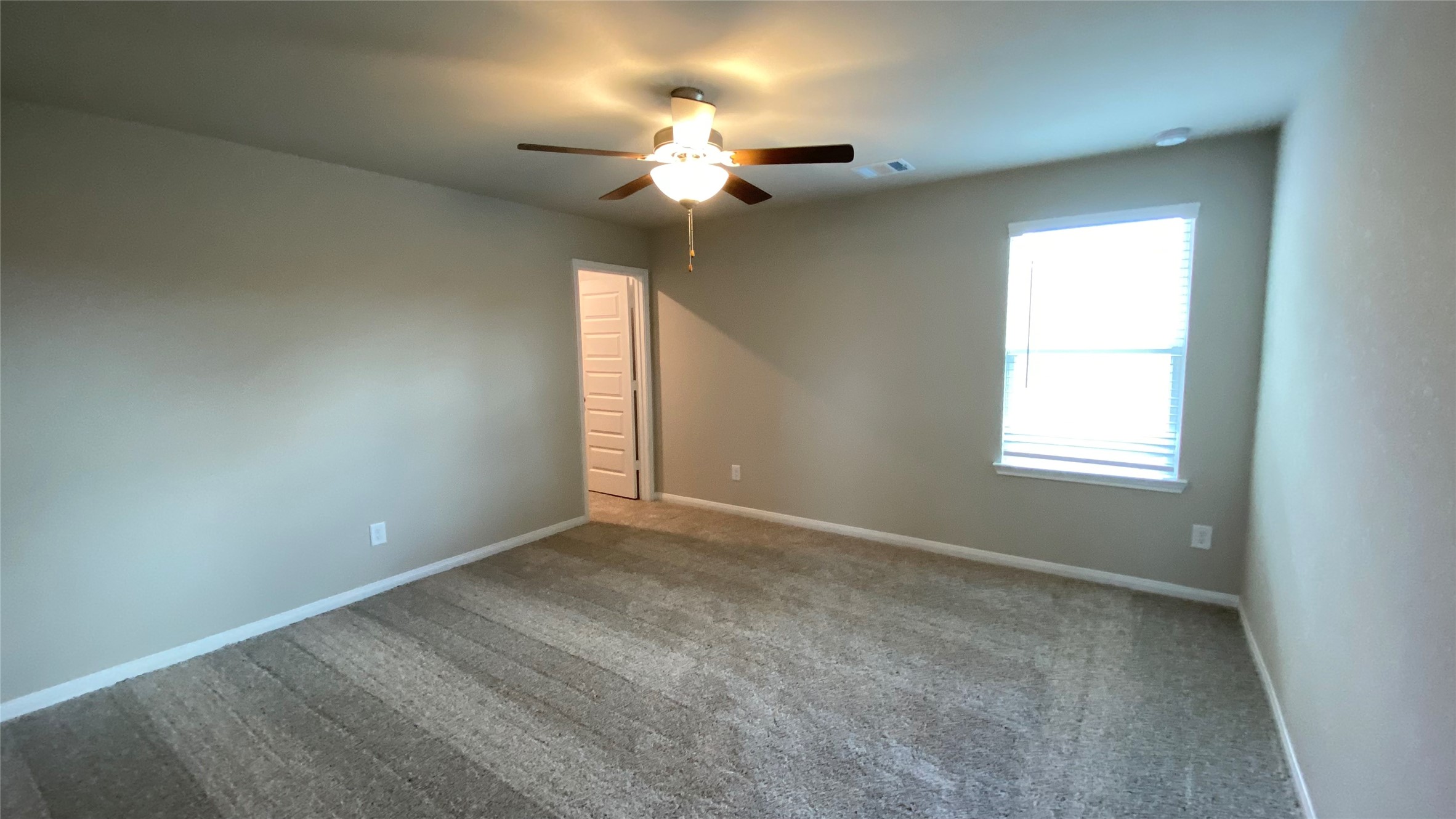 7059 Silverleaf Oak Street Conroe, TX 77304 - Photo 23 of 29 a view of an empty room with a window