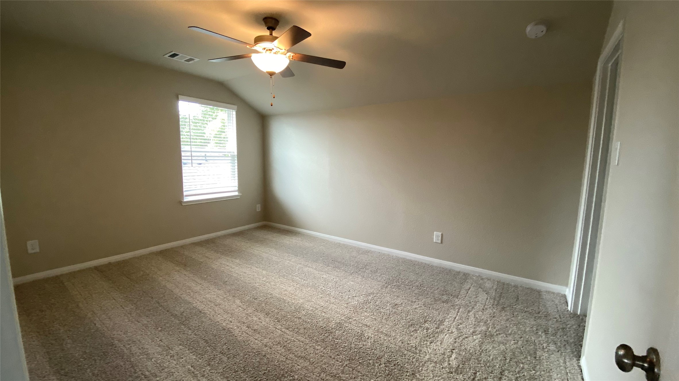 7059 Silverleaf Oak Street Conroe, TX 77304 - Photo 25 of 29 a view of an empty room with a window