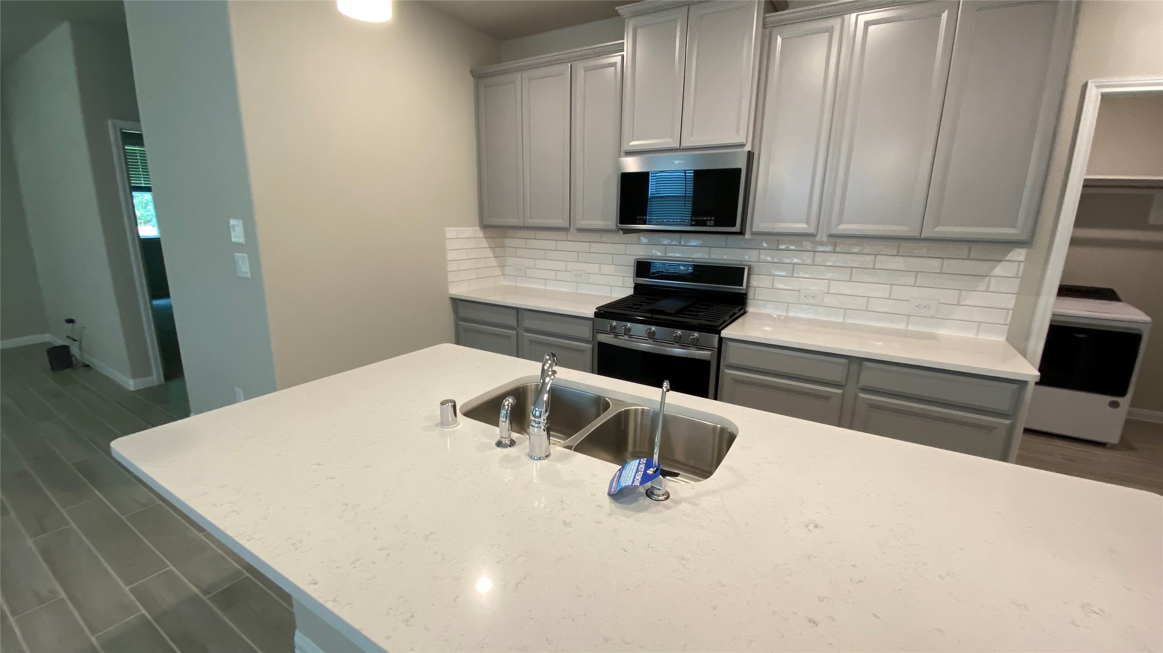 7059 Silverleaf Oak Street Conroe, TX 77304 - Photo 8 of 29 a kitchen with a stove and a refrigerator