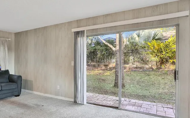 a view of an empty room and window