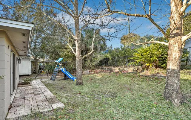 a view of a backyard with a slide