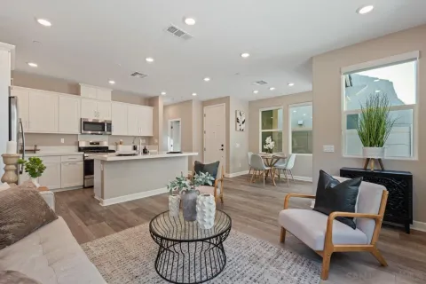 a view of a dining room with furniture and wooden floor
