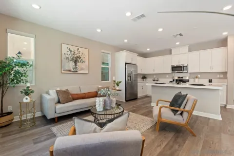 a dining room with furniture and window