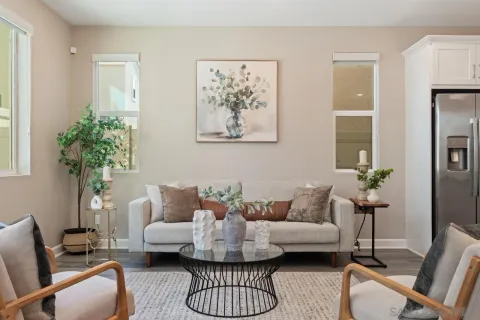 a view of a dining room with furniture and wooden floor