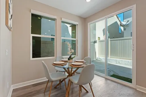 a bedroom with a bed table and a window