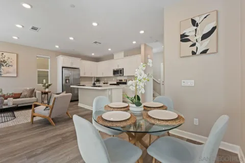 a spacious bathroom with a double vanity sink a mirror and a shower