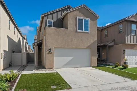 a kitchen with a sink a stove a refrigerator and white cabinets