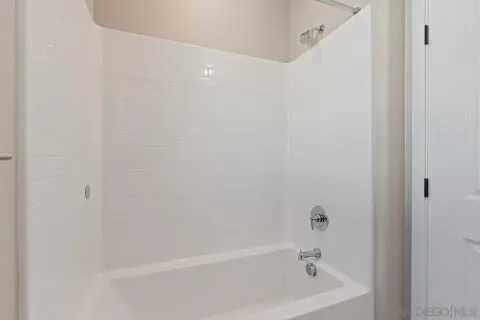 a view of a garden with a building in the background