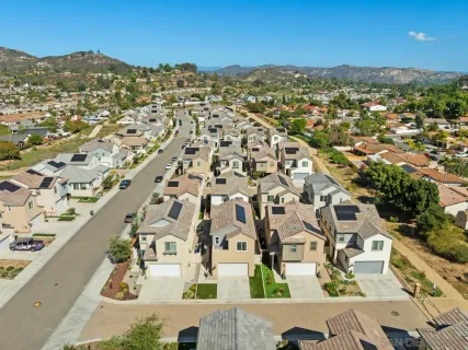 a view of a terrace with furniture and a mountain