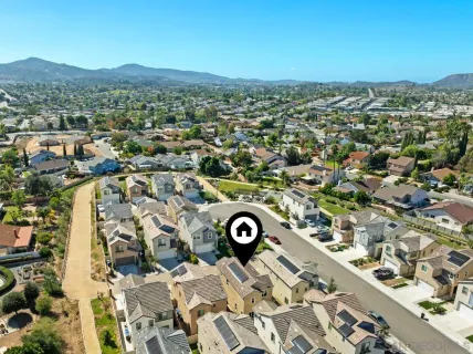 an aerial view of a city with lots of residential buildings