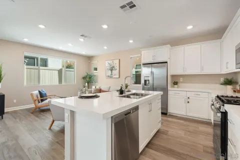 a living room with furniture and flowers