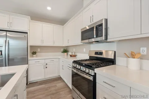 a living room kitchen with kitchen island furniture and a kitchen view