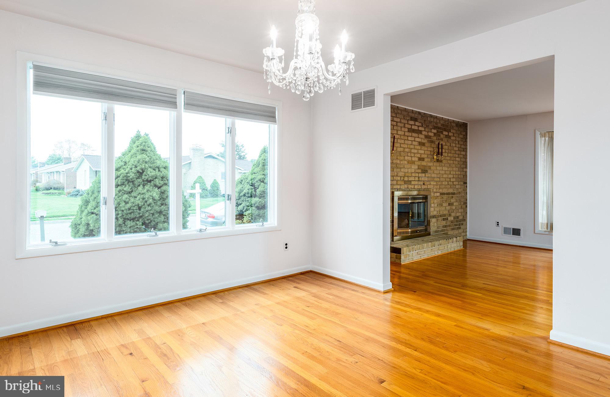9209 Gardenia Road Baltimore, MD 21236 - Photo 11 of 34 Dining Room with Elegant Chandelier