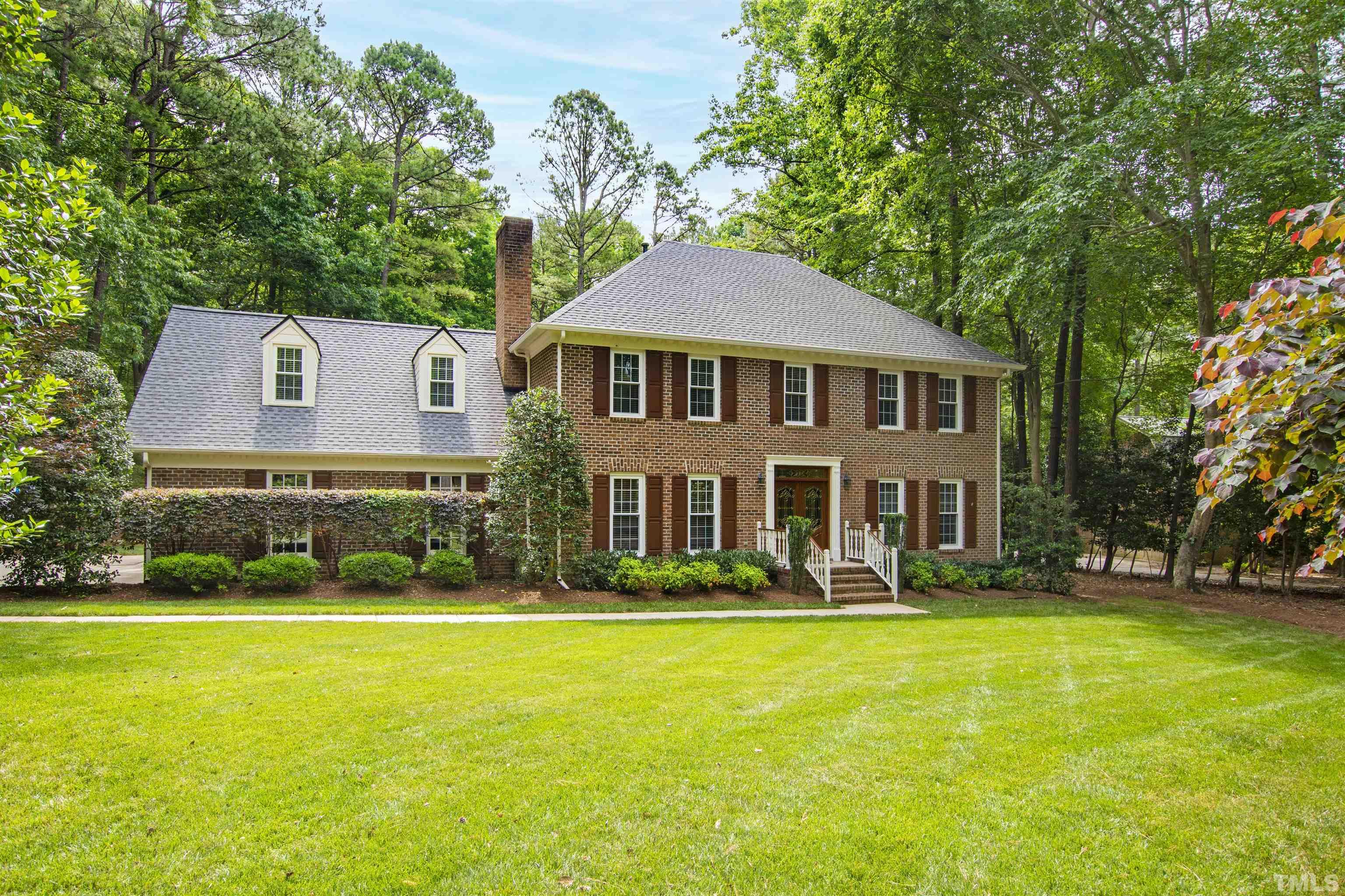 4708 Fallswood Place Raleigh, NC 27613 - Photo 1 of 45 a front view of a house with garden