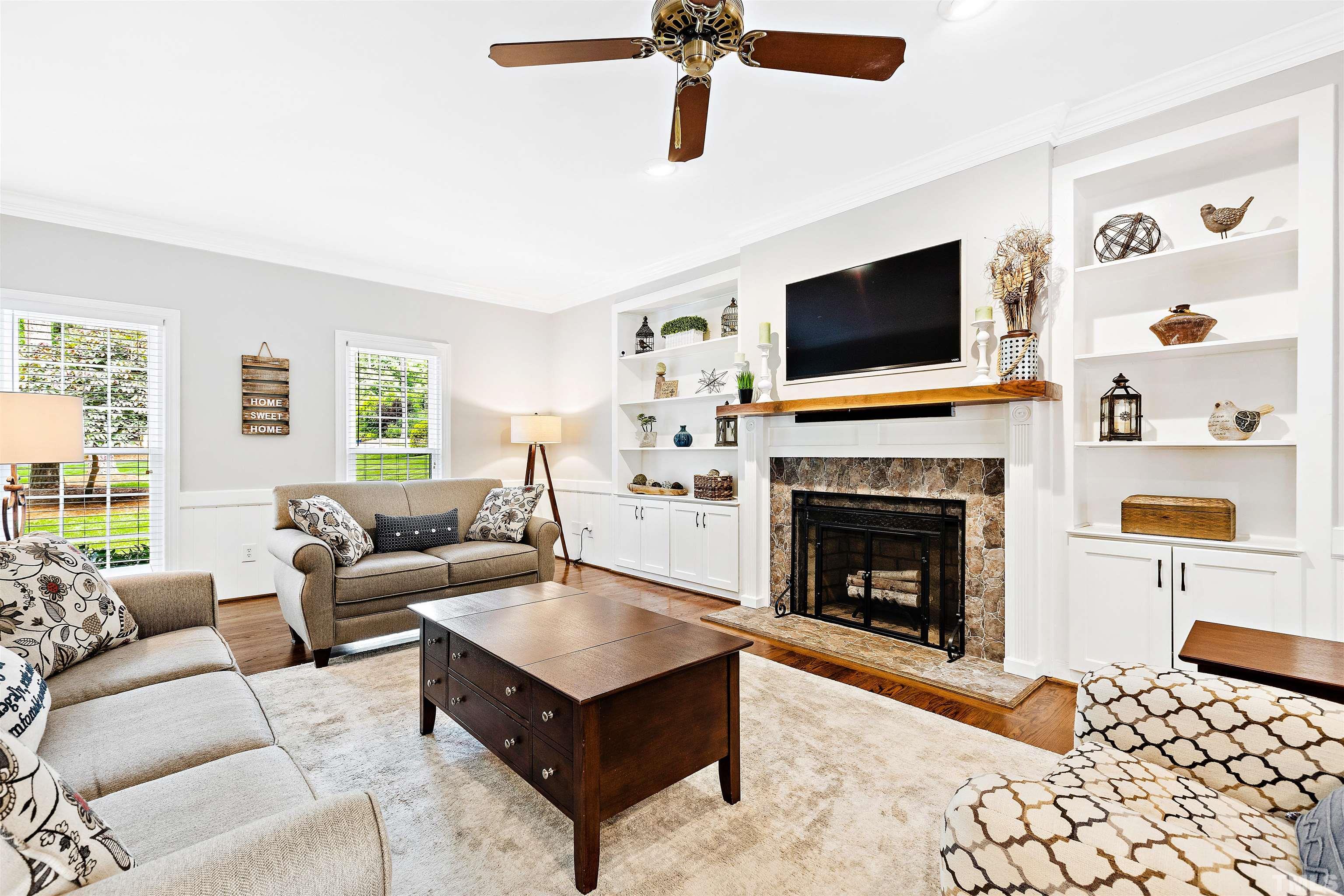 4708 Fallswood Place Raleigh, NC 27613 - Photo 15 of 45 a living room with furniture fireplace and flat screen tv