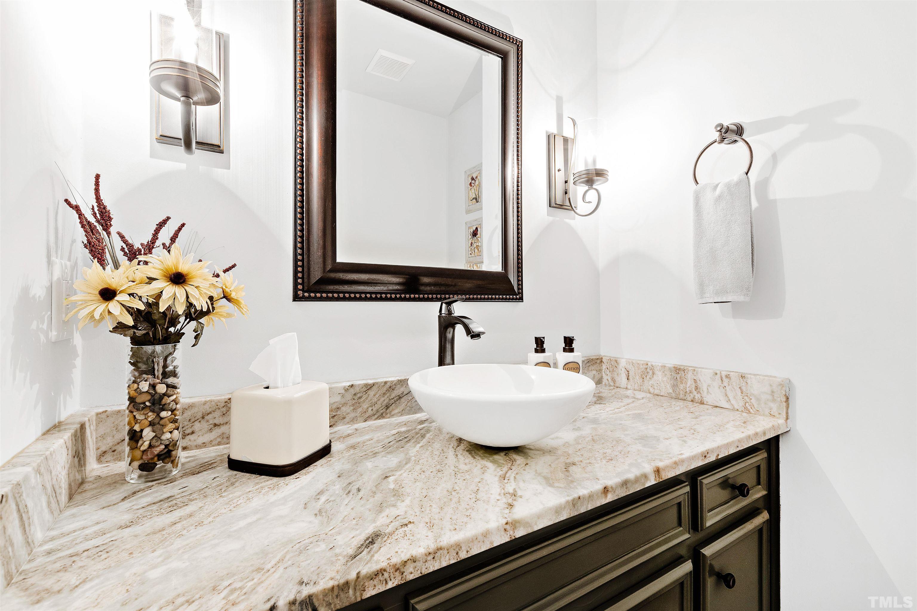 4708 Fallswood Place Raleigh, NC 27613 - Photo 17 of 45 a bathroom with a granite countertop sink a mirror and a