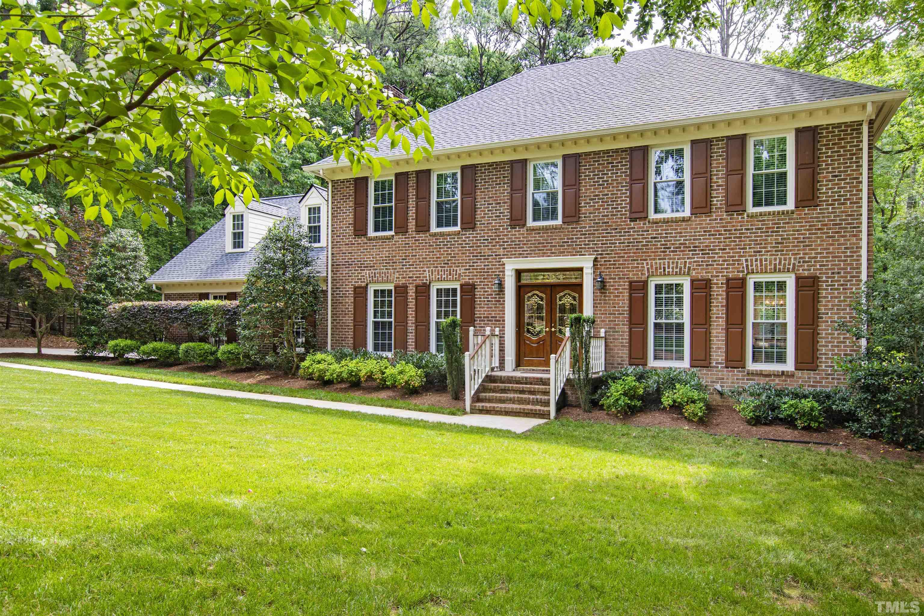 4708 Fallswood Place Raleigh, NC 27613 - Photo 2 of 45 a front view of house with yard and green space