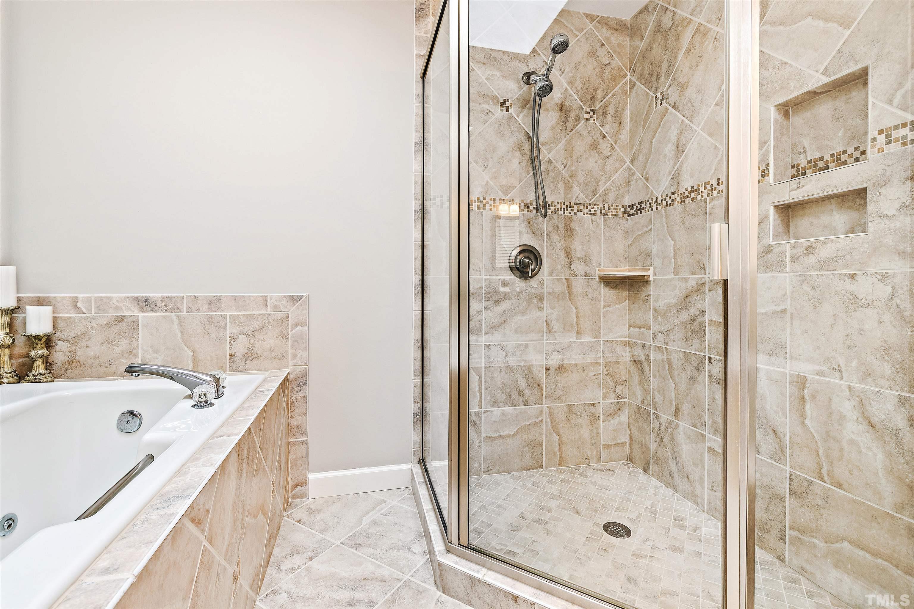 4708 Fallswood Place Raleigh, NC 27613 - Photo 25 of 45 a bathroom with a bathtub and shower