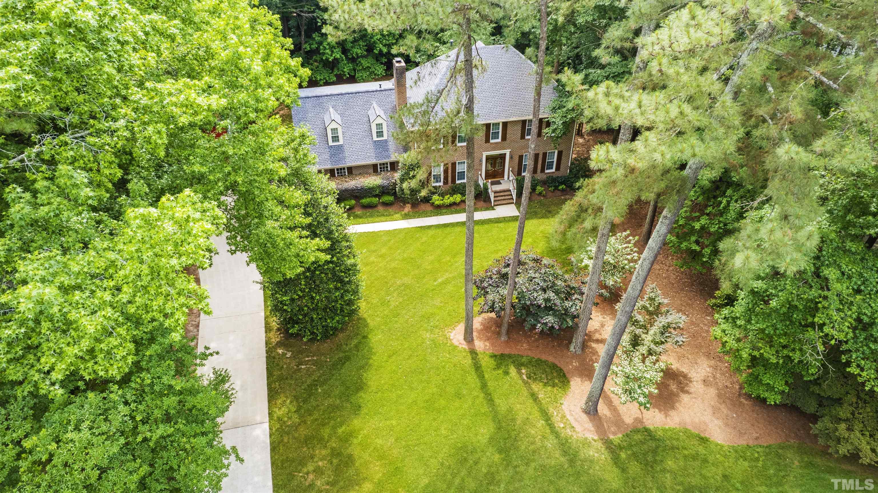 4708 Fallswood Place Raleigh, NC 27613 - Photo 3 of 45 a view of a garden