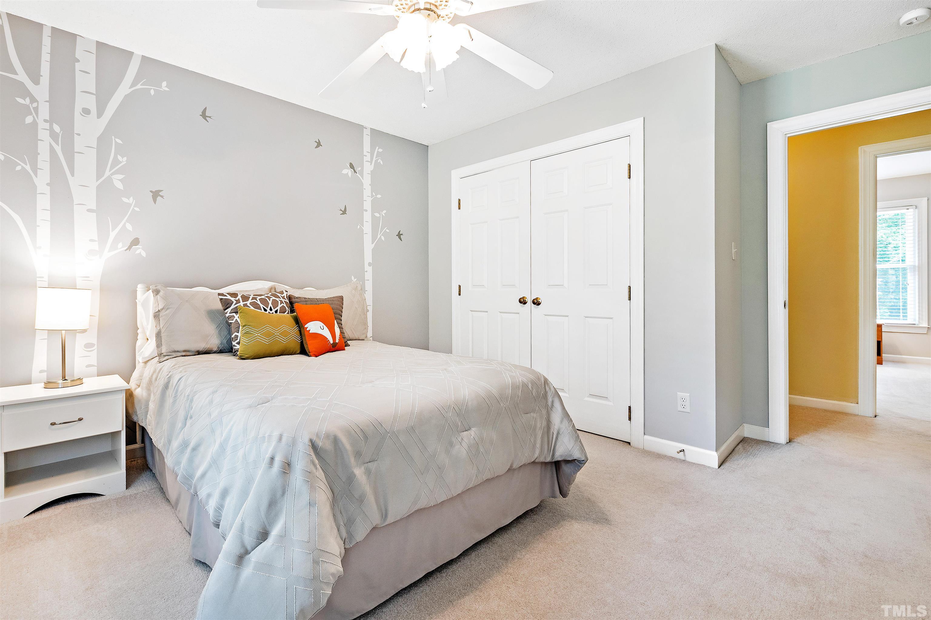 4708 Fallswood Place Raleigh, NC 27613 - Photo 31 of 45 a bedroom with a bed and a window