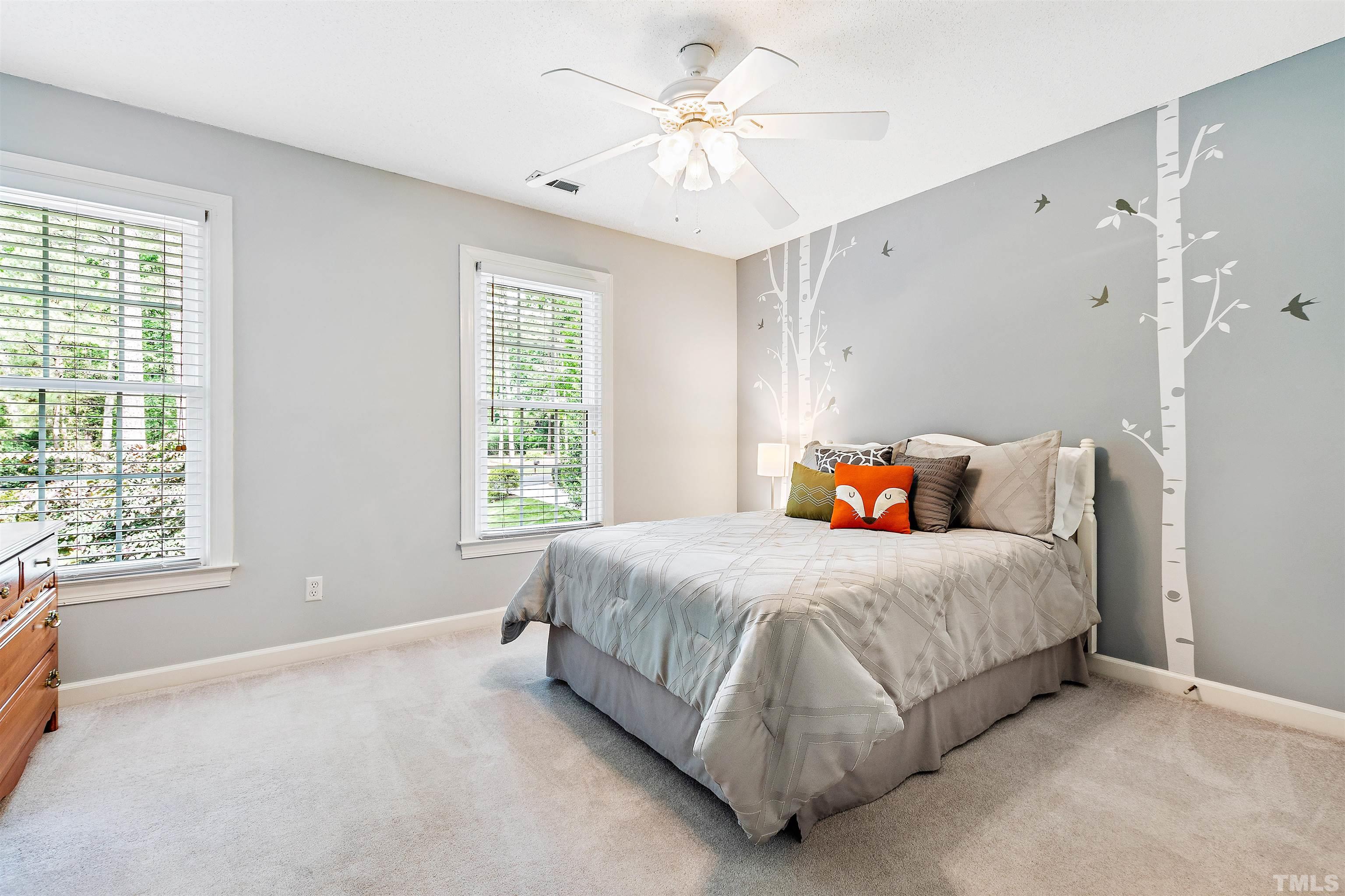 4708 Fallswood Place Raleigh, NC 27613 - Photo 32 of 45 a bedroom with bed and window