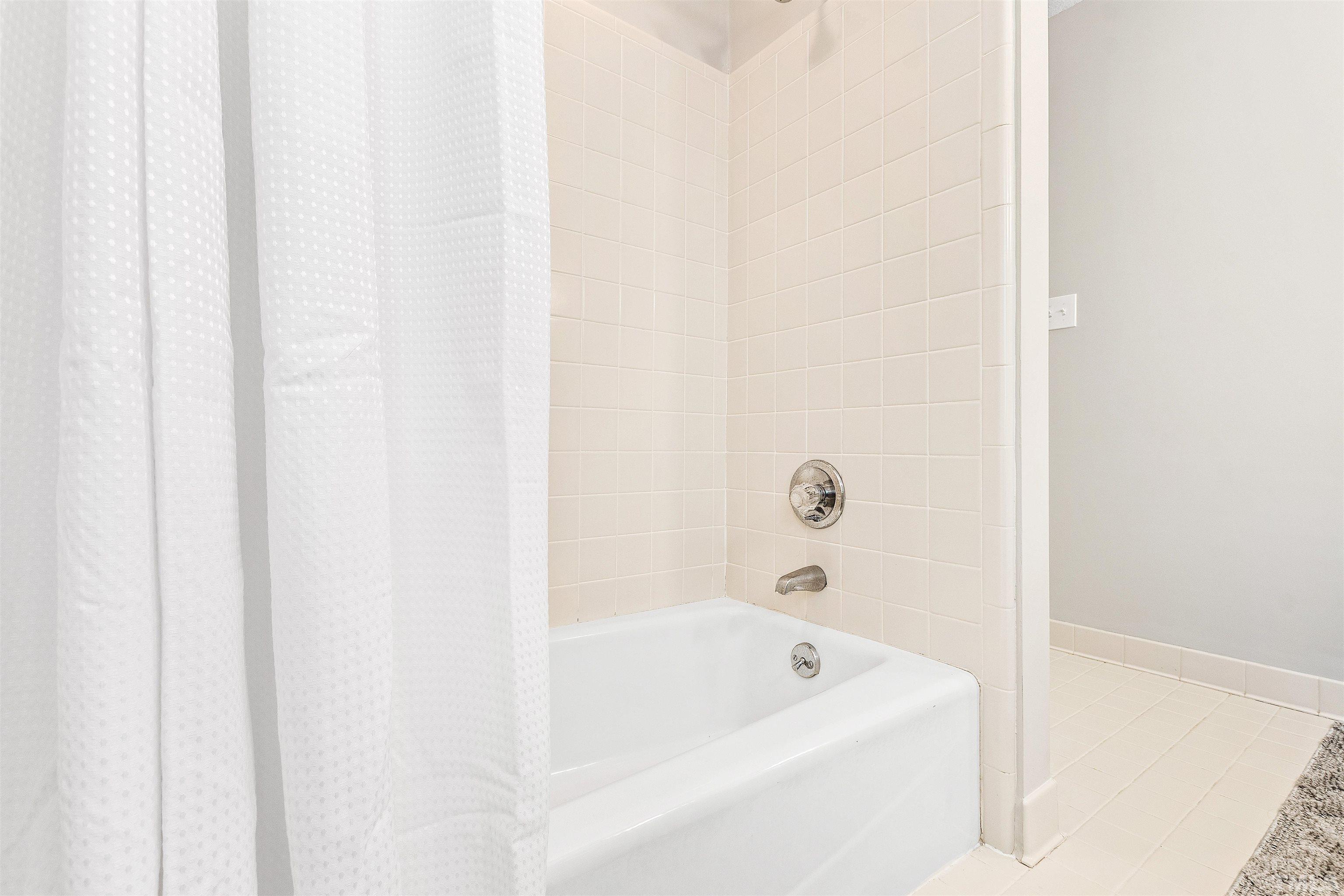 4708 Fallswood Place Raleigh, NC 27613 - Photo 34 of 45 a bathroom with a bathtub