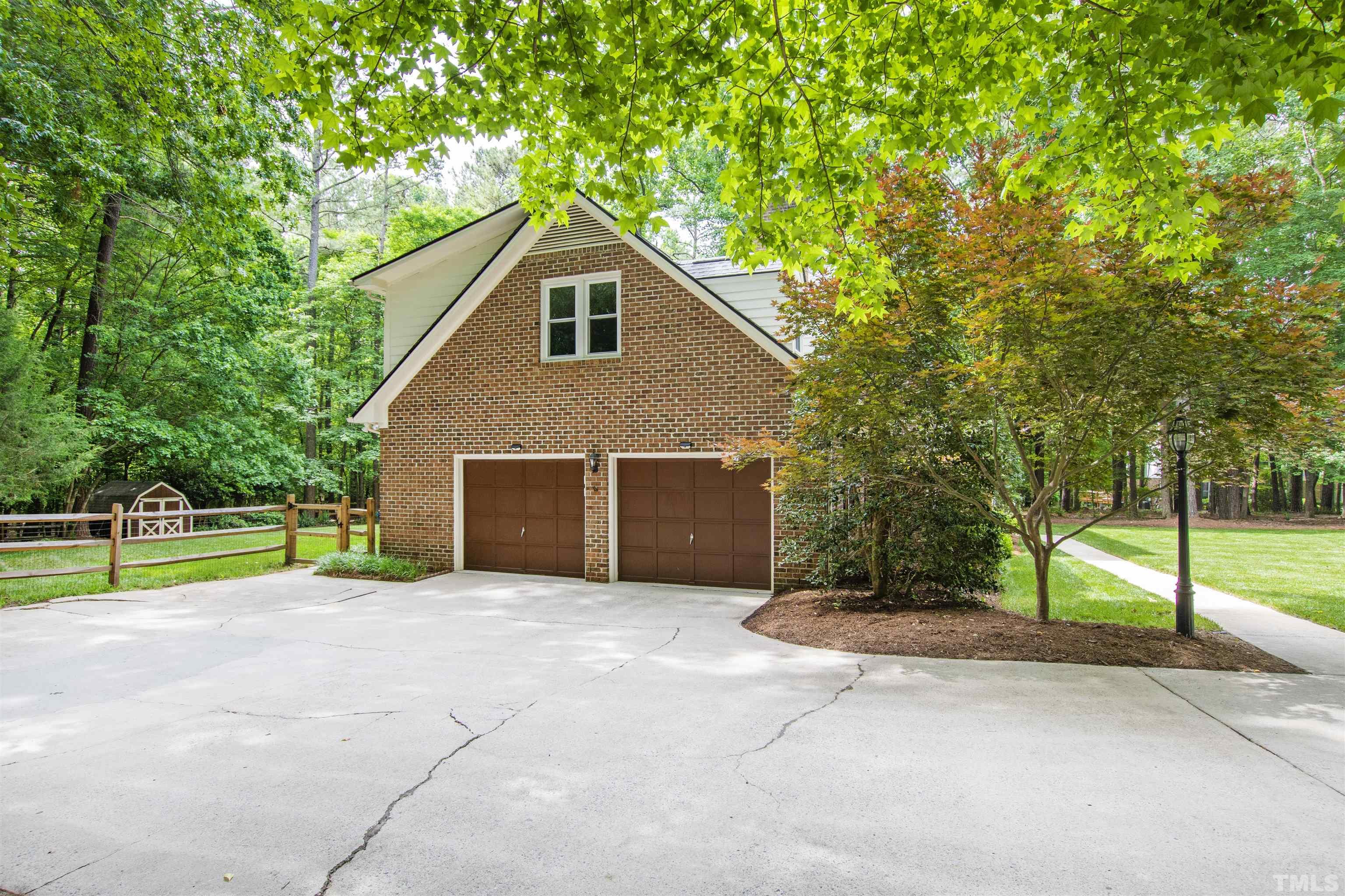 4708 Fallswood Place Raleigh, NC 27613 - Photo 38 of 45 a view of backyard with large tree