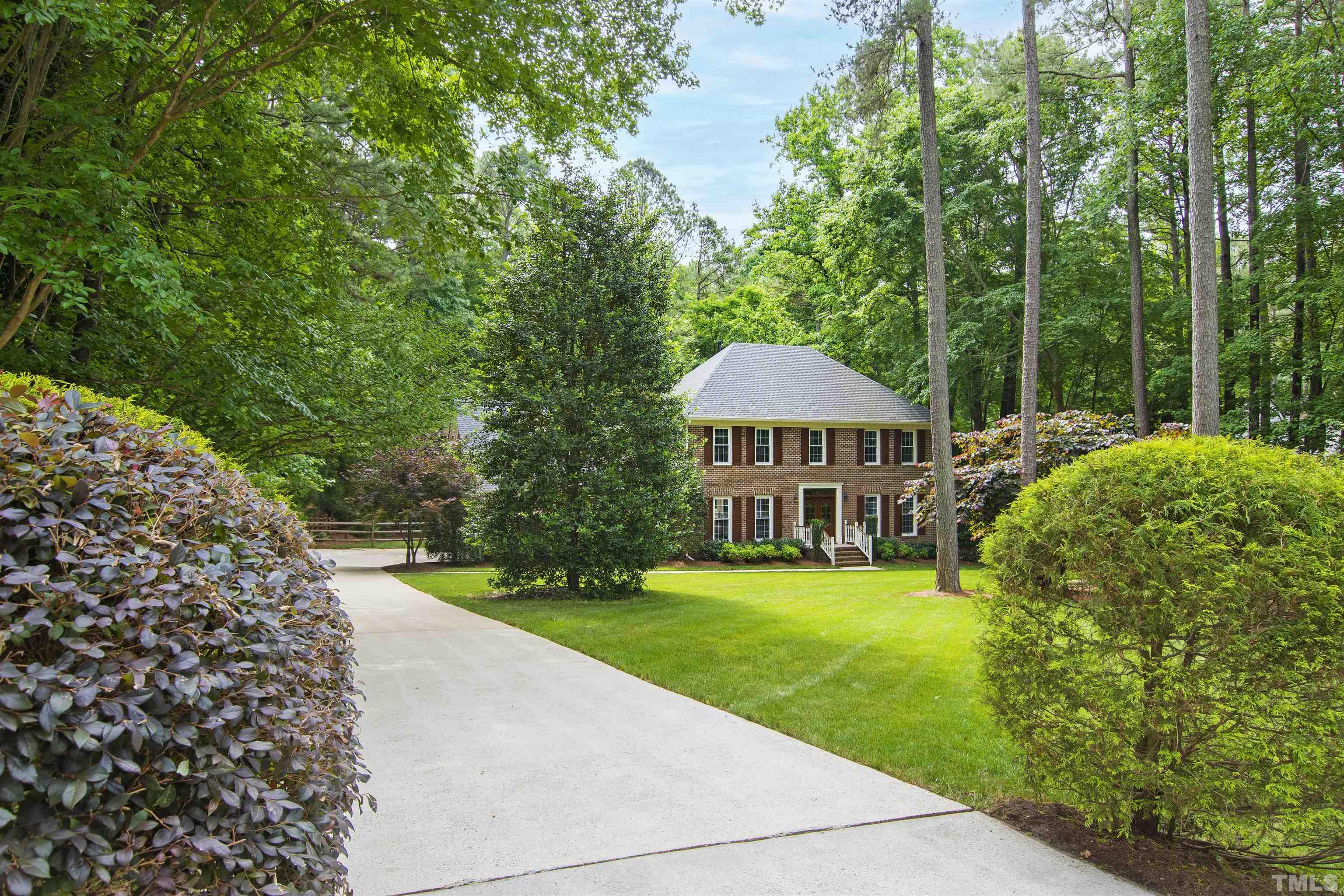 4708 Fallswood Place Raleigh, NC 27613 - Photo 4 of 45 a view of a house with garden
