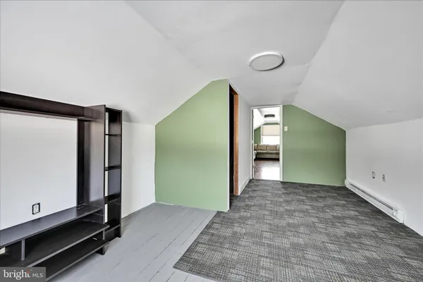 a view of a room with window and stairs