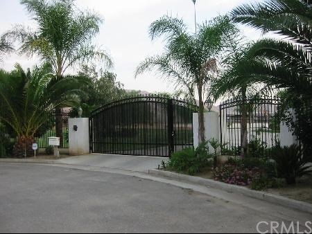 260 East Main Street Riverside, CA 92507 - Photo 1 of 1 a front view of a house with a garden and palm trees