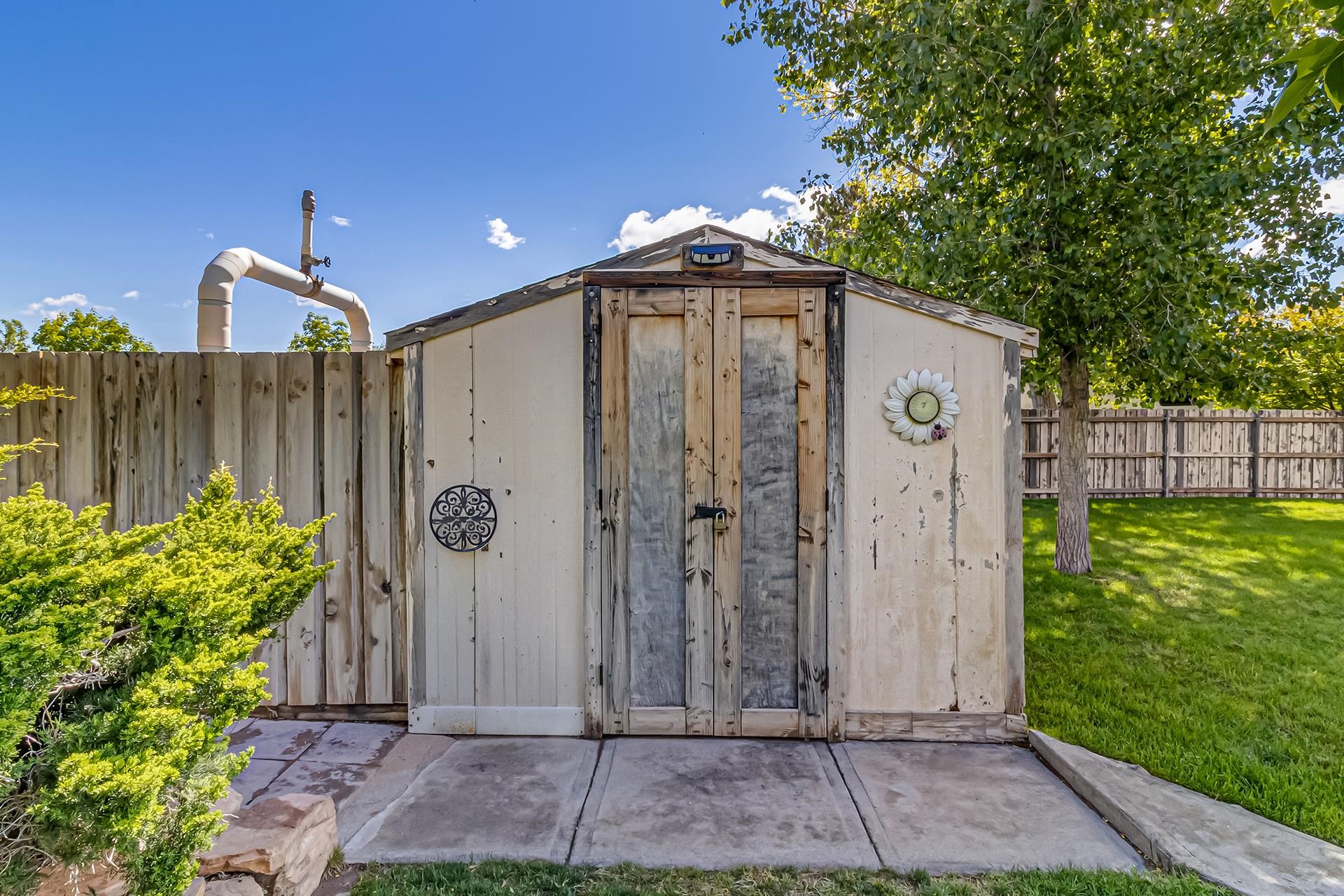 2118 Saguaro Road Grand Junction, CO 81507 - Photo 32 of 42 a front view of a house with garden