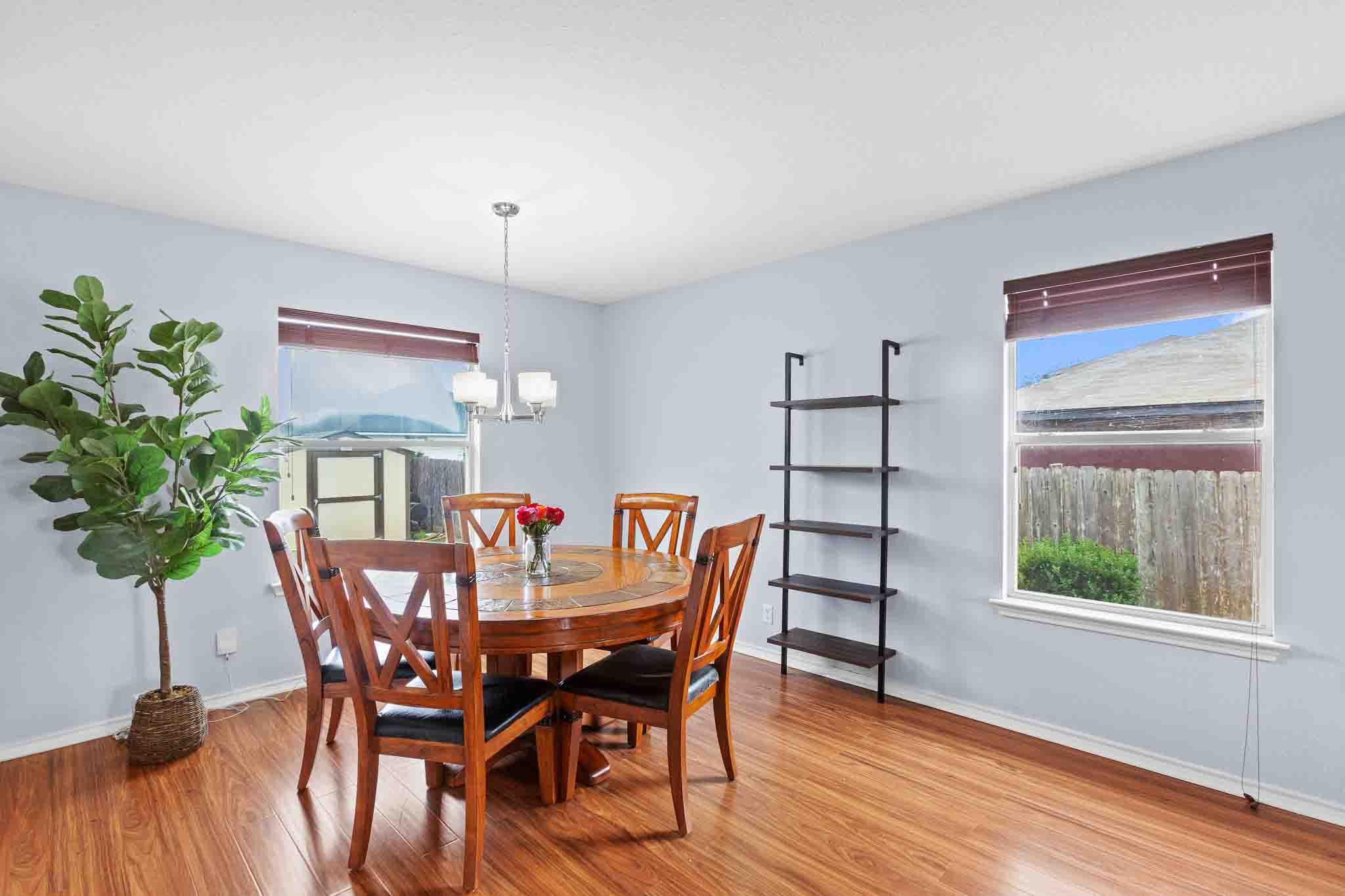 270 Endeavour Kyle, TX 78640 - Photo 6 of 20 This room features hardwood floors, light blue walls, and two windows allowing for natural light