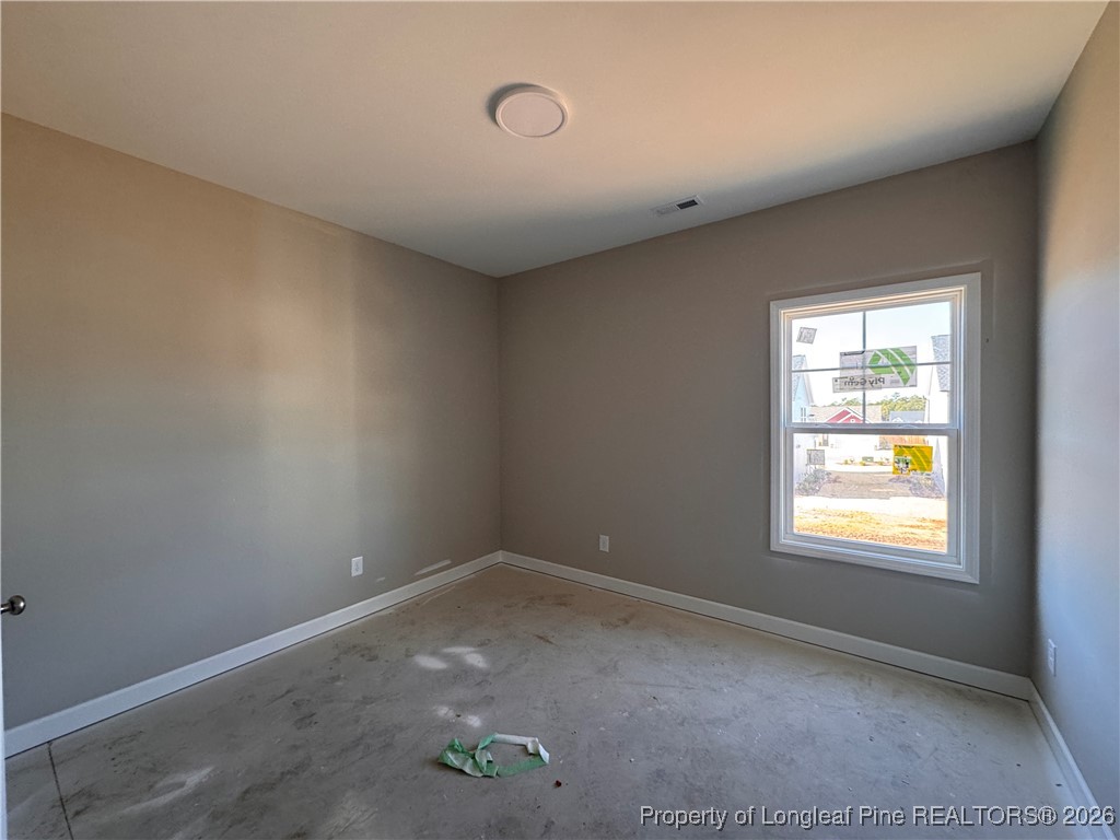 244 Rough Rdg Trail Aberdeen, NC 28315 - Photo 11 of 25 an empty room with a window